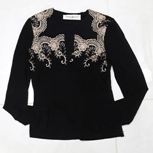 Elegant black blouse with tan design